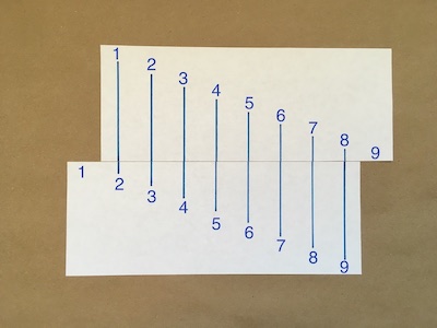 Eight numbered lines drawn on a piece of paper