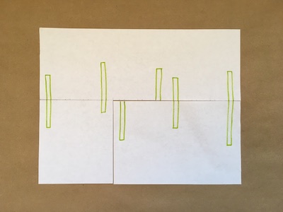 Six green rectangles on a piece of paper
