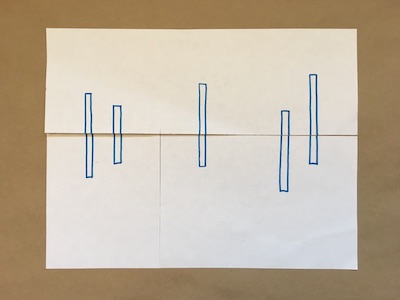 Five blue rectangles on a piece of paper