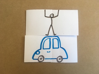 Flexagon with person standing on top of car