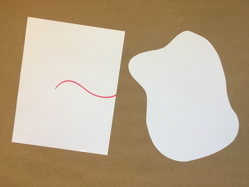 Cut pieces of paper with a line drawn