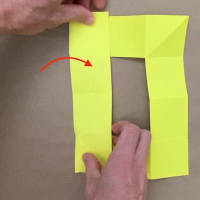 Folding the left side of the paper over