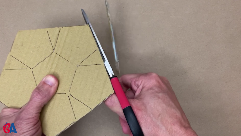 Cutting out the pentagon shapes