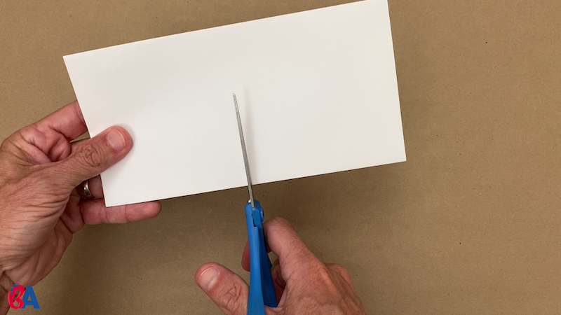 Cutting a sealed envelope in half