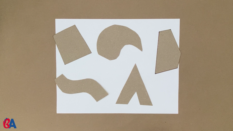 Cardboard shapes covering a piece of paper