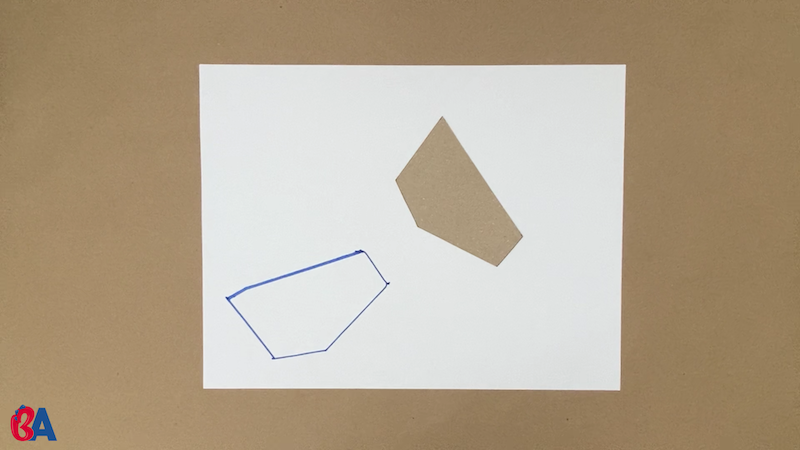 Tracing a shape on the piece of paper