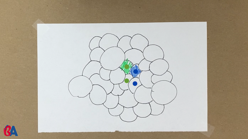 Bunch of circles with some colored in green and blue