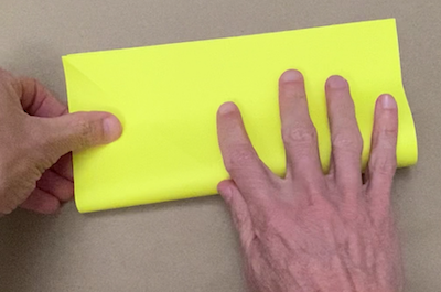 Folding a square of paper in half