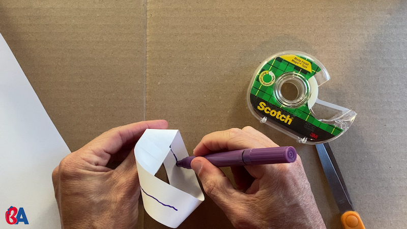 Drawing a line down the center of a mobius strip
